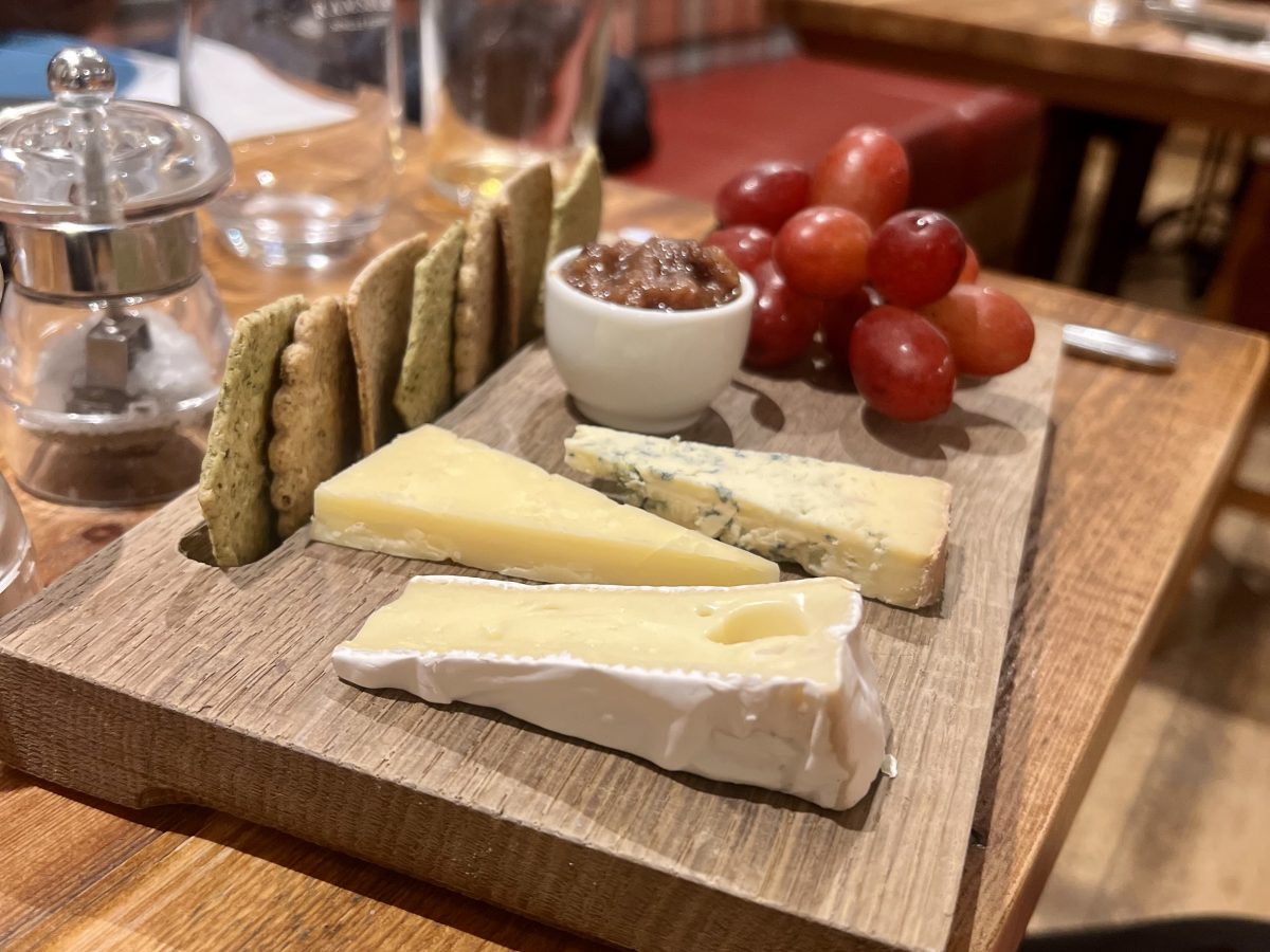 Cheeseboard with brie, blue cheese and grapes at The Bell Ramsbury